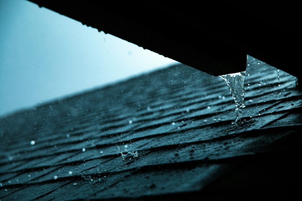 A close up of a rain gutter on a roof